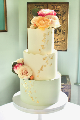 Buttercream Wedding Cake with roses and gold leaf